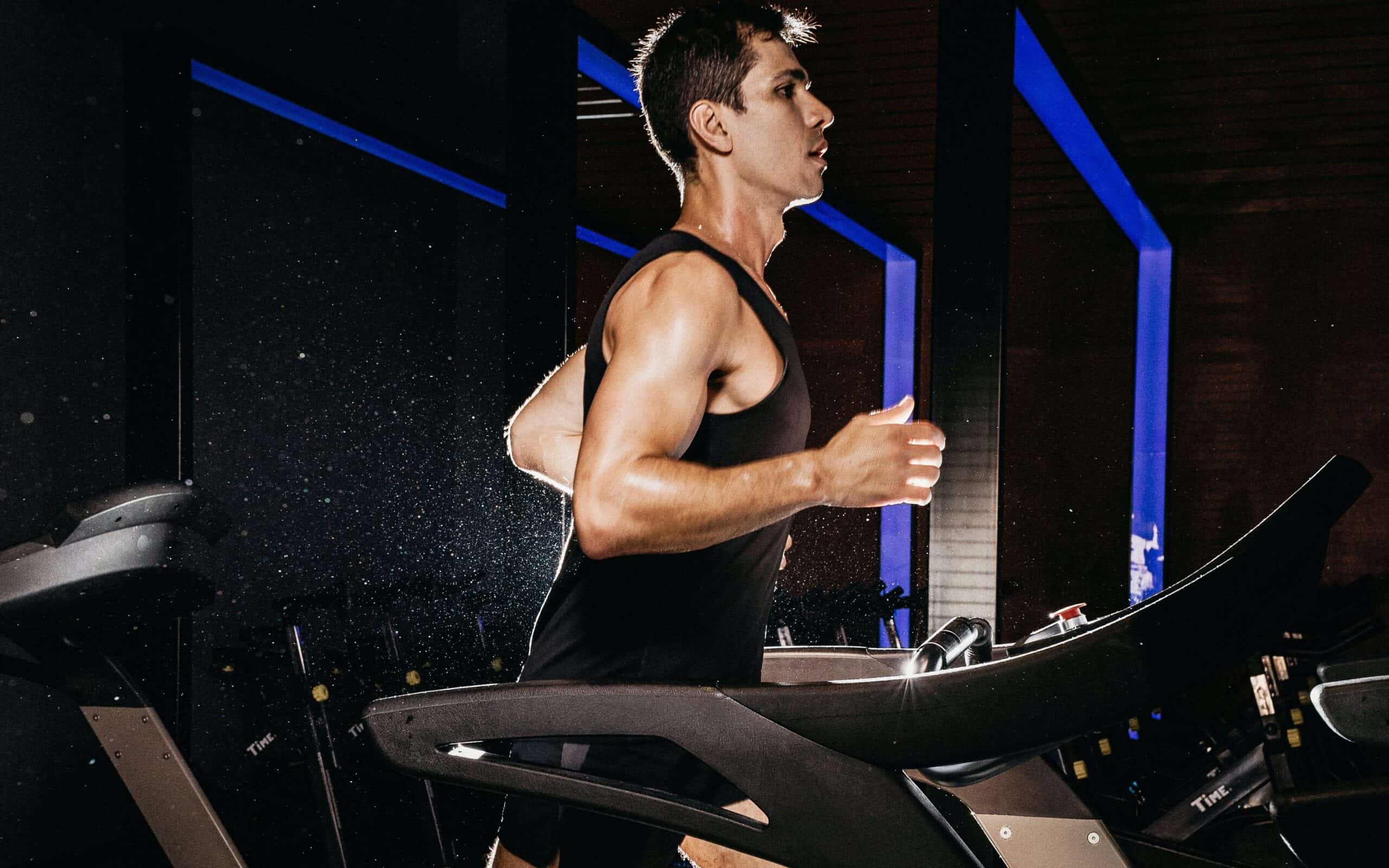 A runner completing an interval workout during marathon training treadmill