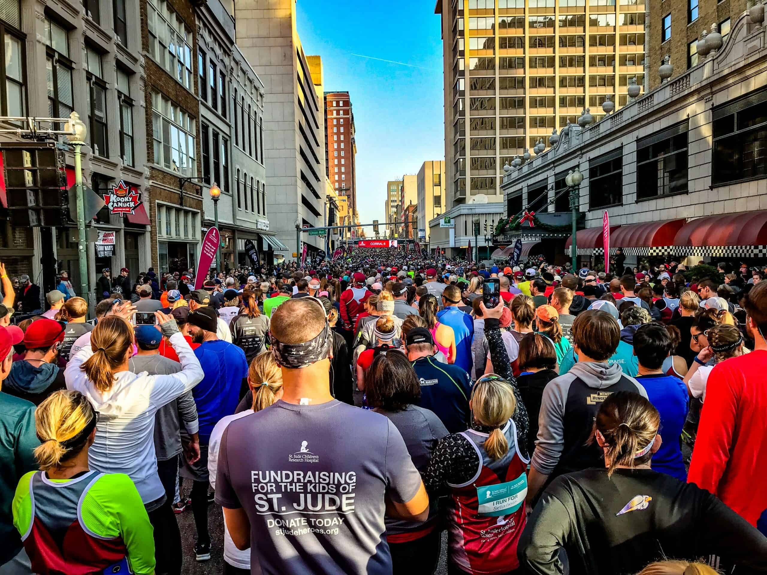 Runners who have trained for a half marathon at the starting line.