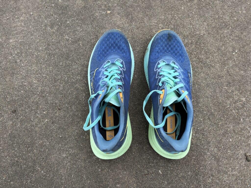 A top-down view of well-worn Hoka Mach 6 running shoes after testing.